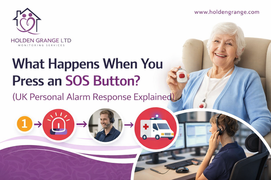 Monitoring centre operator in a headset at her screens, with an older woman holding a pendant alarm