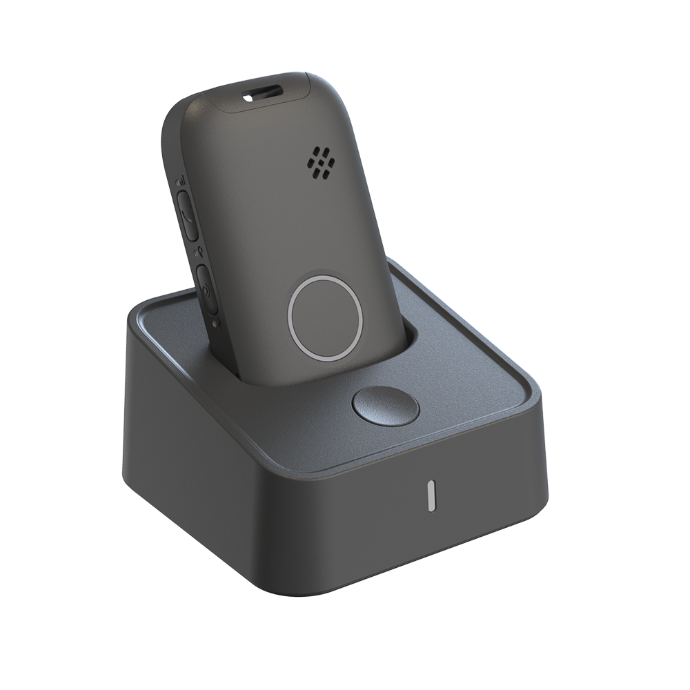 Black electronic device on a matching stand against a white background